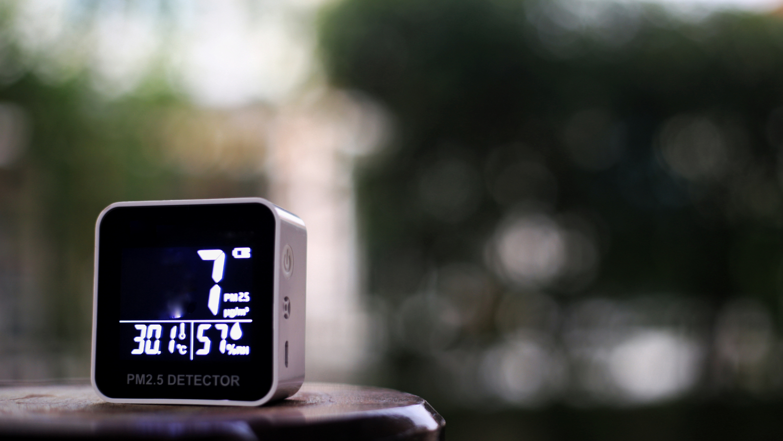 The weather station hygrometer shows normal humidity and temperature